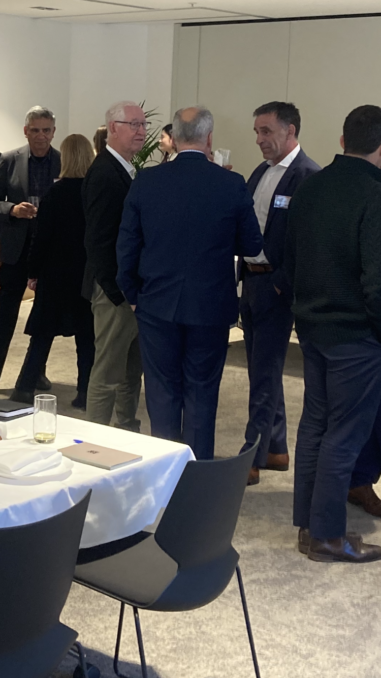 Guests in conversation at the EORA Energy industry roundtable in Sydney — photograph 1