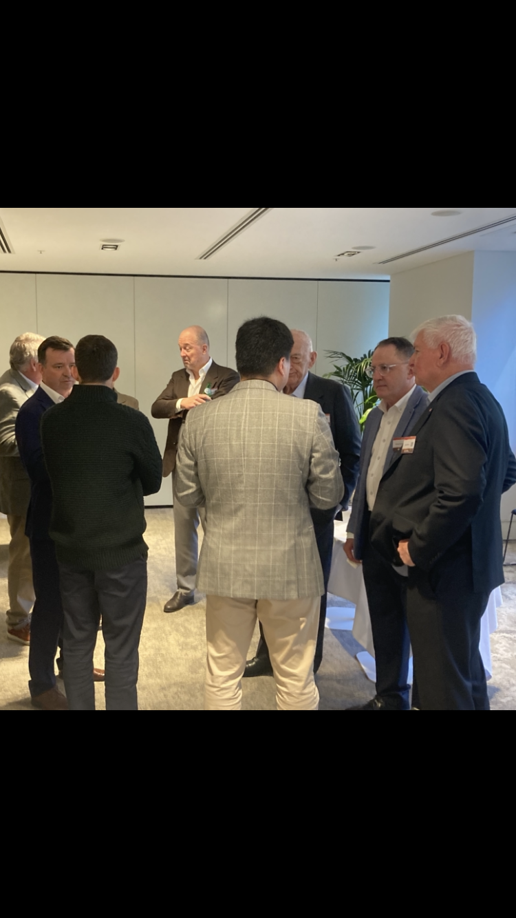 Guests in conversation at the EORA Energy industry roundtable in Sydney — photograph 3